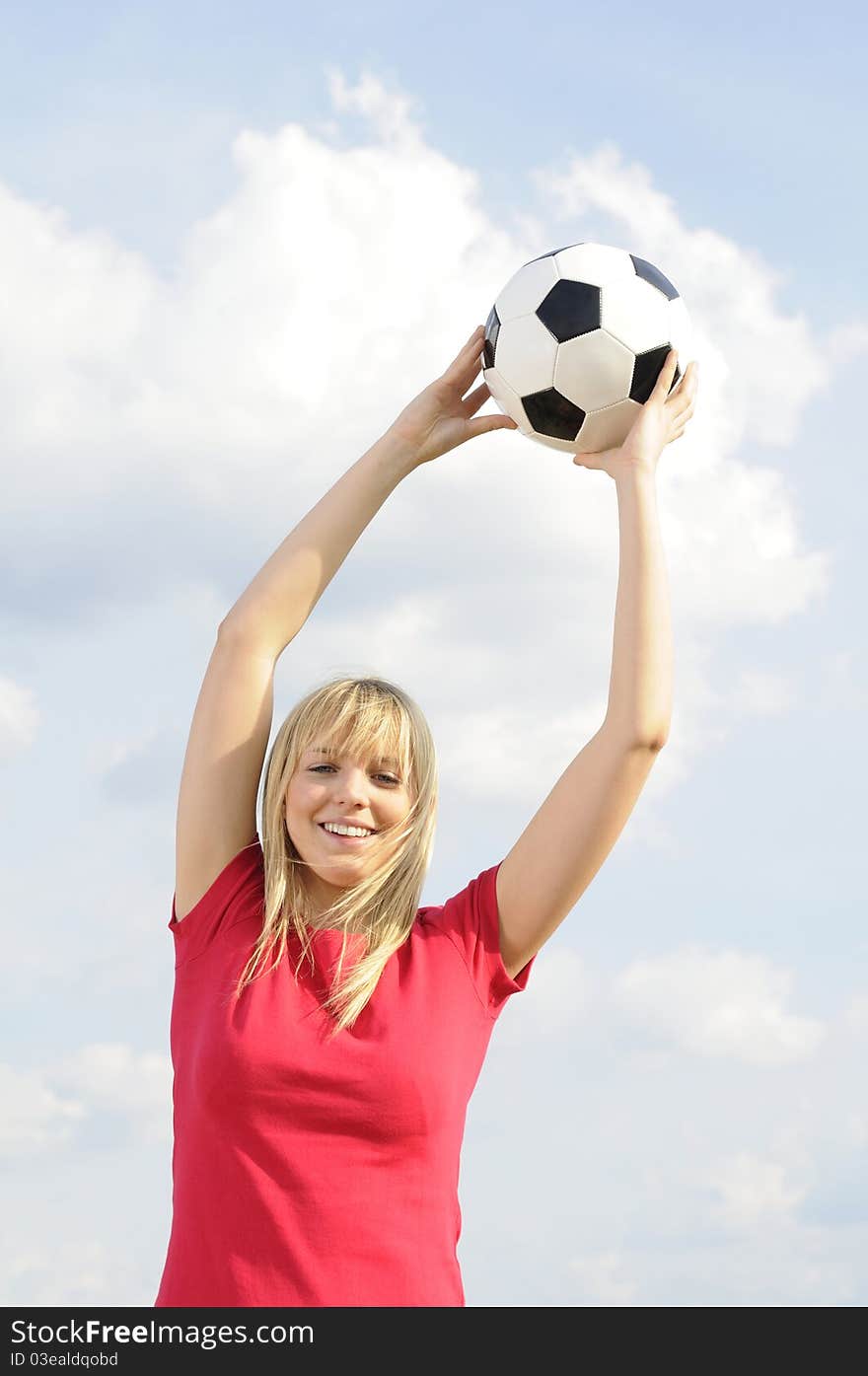 Young woman with soccer ball