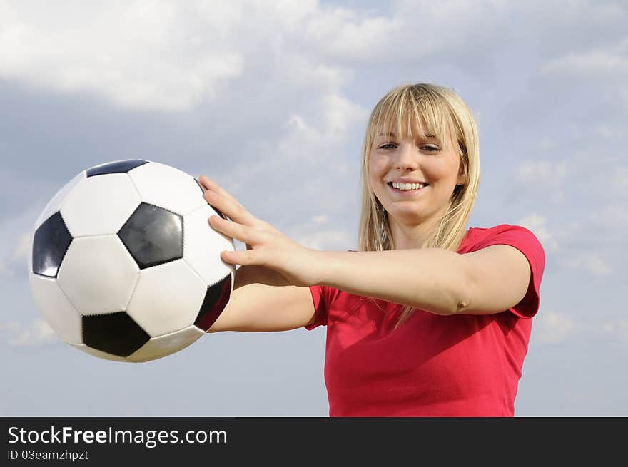 Young woman with soccer ball