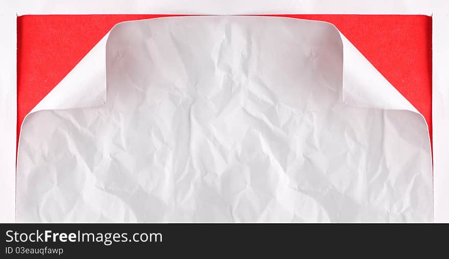 White paper torn with red background underneath