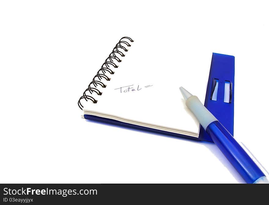 A notebook and a blue pen isolated on white background. A notebook and a blue pen isolated on white background