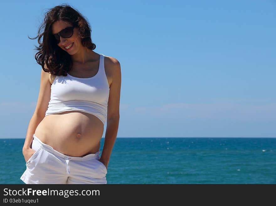 Pregnant mother talking to daughter