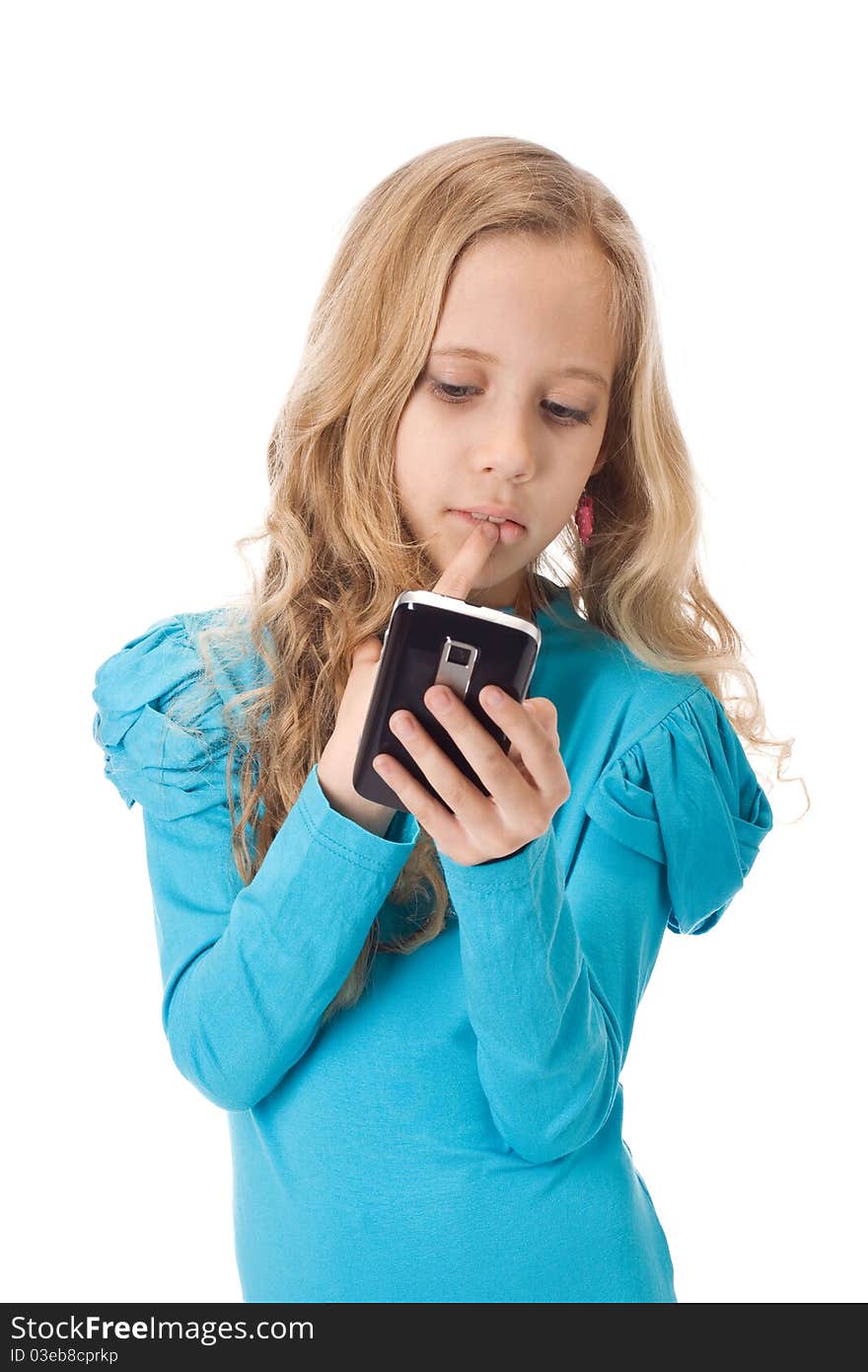 Young girl playing games in her new mobile phone. Young girl playing games in her new mobile phone