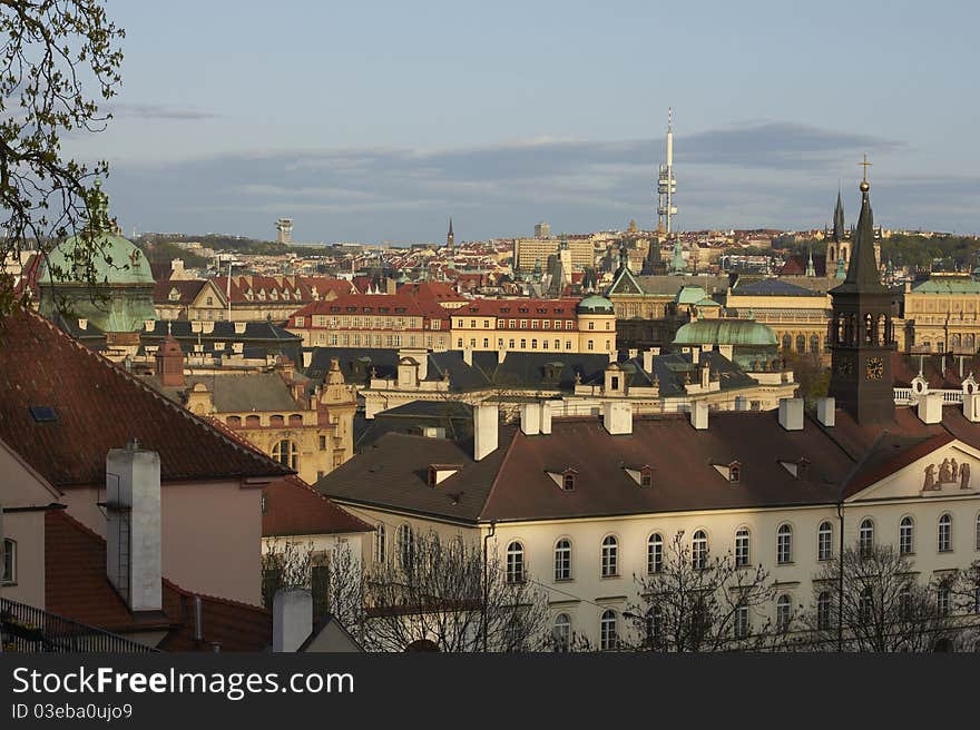 Prague rooftops view from the Prague Castle area (Looking south-east from Prague.) In view: tower of the government seat, Žižkov television tower and Church of Our Lady before Týn (Týnský chrám). Prague rooftops view from the Prague Castle area (Looking south-east from Prague.) In view: tower of the government seat, Žižkov television tower and Church of Our Lady before Týn (Týnský chrám).