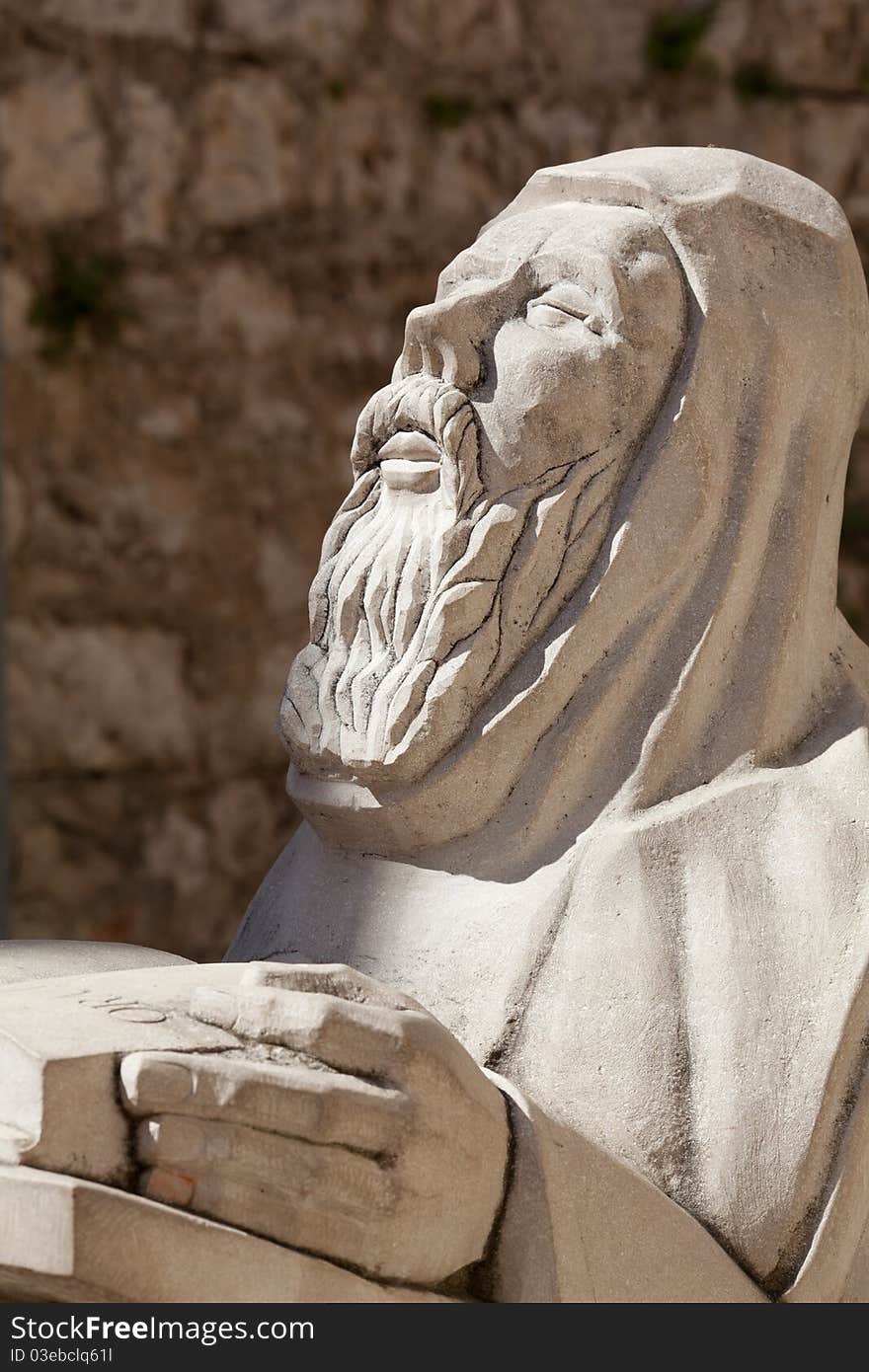 Praying man statue outside Benedictine Monastary, Hvar Croatia. Praying man statue outside Benedictine Monastary, Hvar Croatia