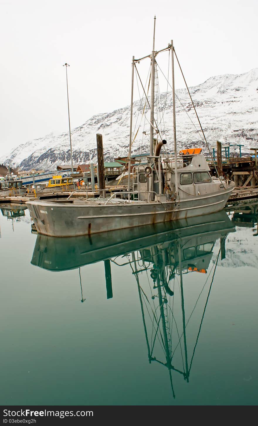 Boat docked on still waters