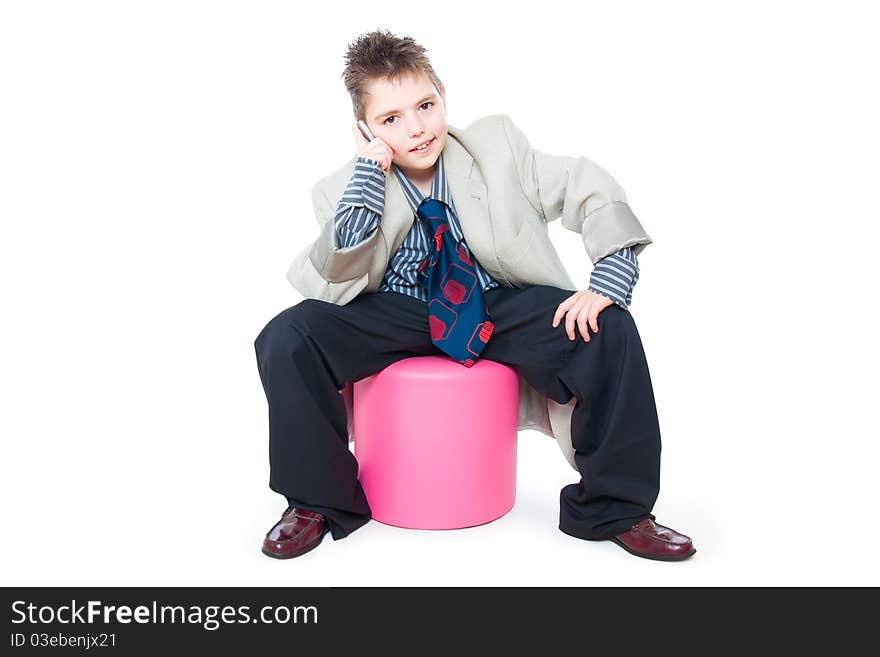 Child as a business man talking on the phone. Child as a business man talking on the phone