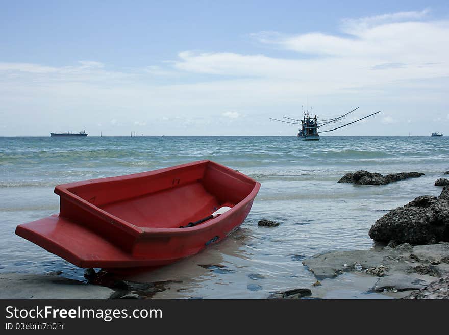 Red Boat on the beach in Thailand