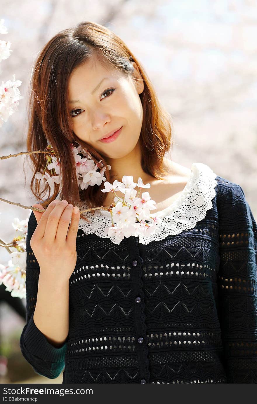 Portrait of young japanese woman in the spring garden. Portrait of young japanese woman in the spring garden