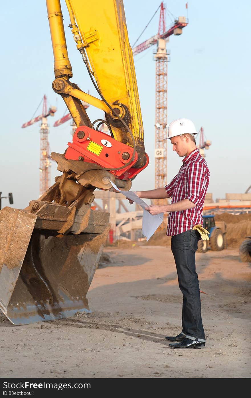 Architect Working Outdoors On A Construction Site