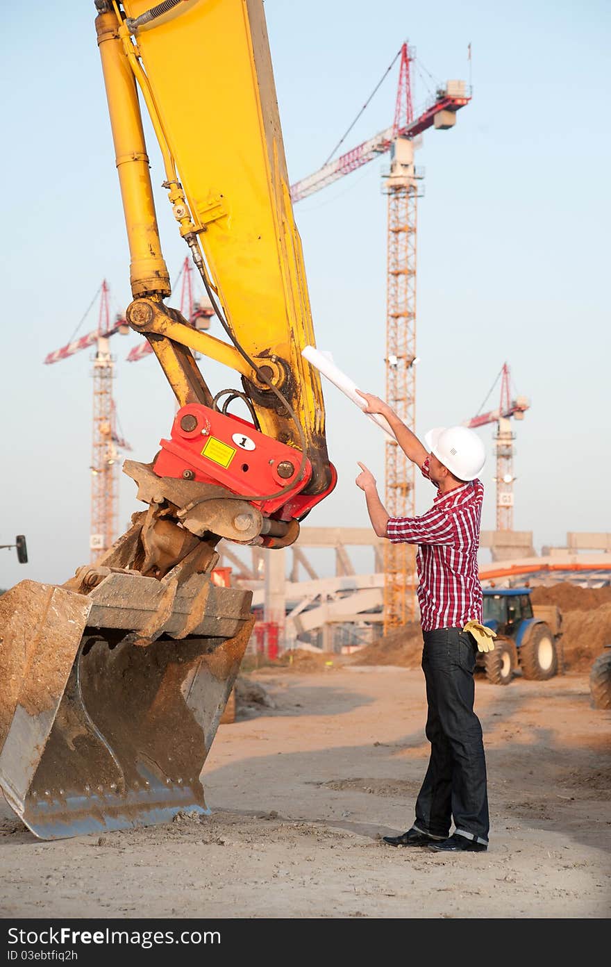 Young architect working outdoors on a construction site