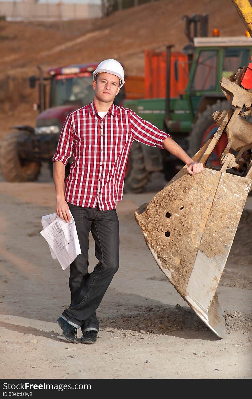 Young architect working outdoors on a construction site