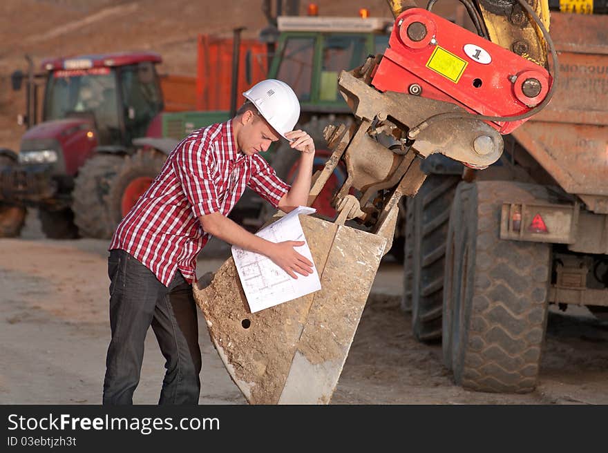 Young architect working outdoors on a construction site