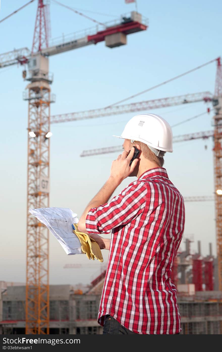 Young architect working outdoors on a construction site