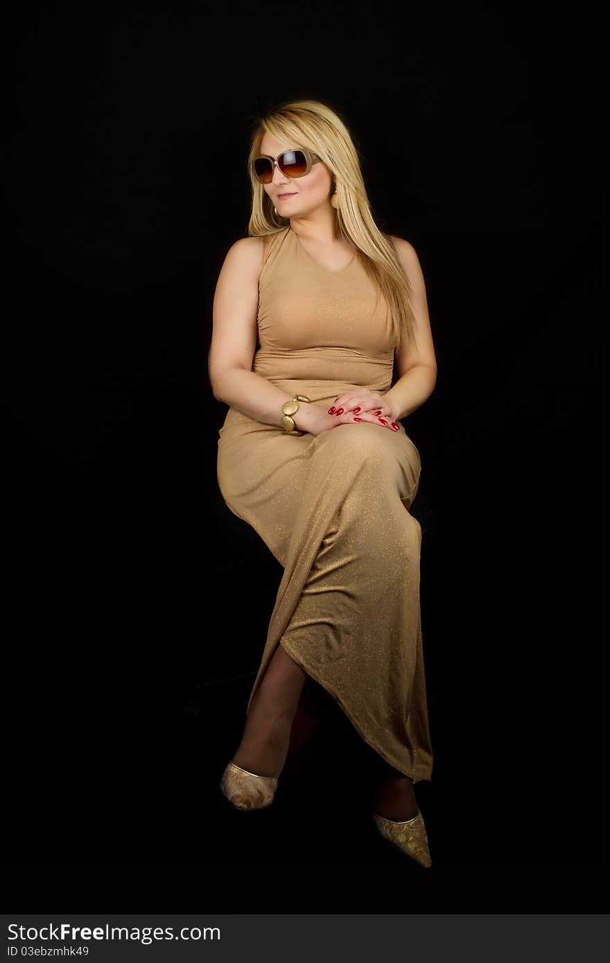 Lady Posing in Studio on Black Background. Lady Posing in Studio on Black Background