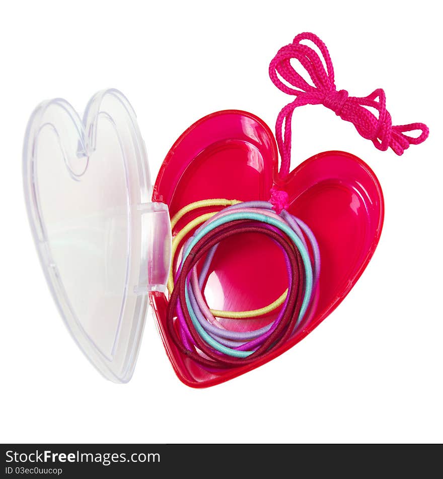 Colorful hair bands in a plastic, heart-shaped case.