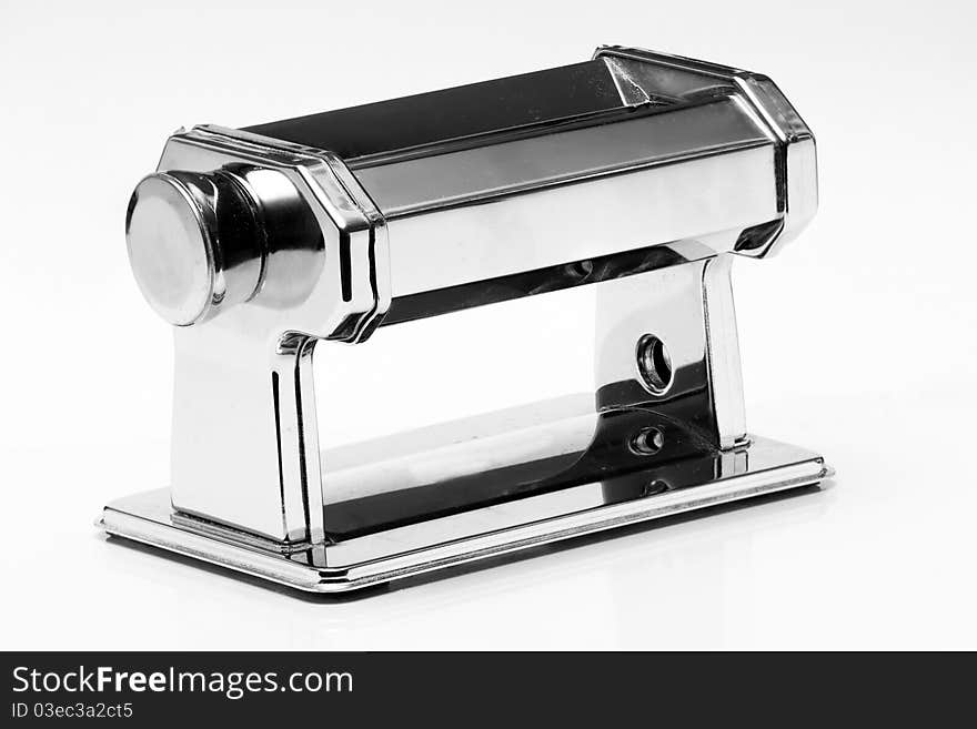 Pasta machine in black and white over a lightly graduated backdrop