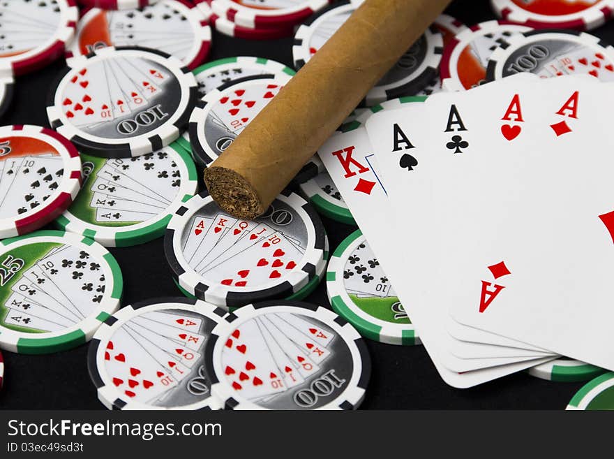 Poker of aces, chips and a cigar