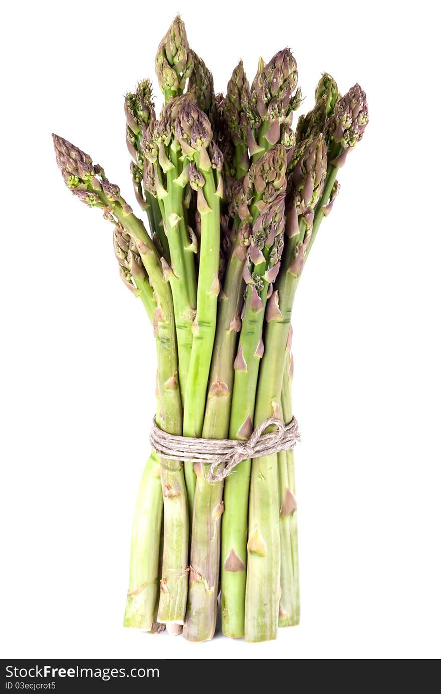 A bunch of green asparagus in front of white background