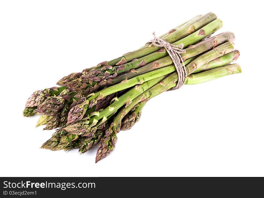 A bunch of green asparagus in front of white background