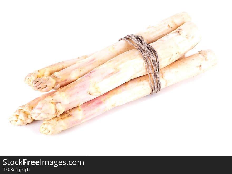 A bunch of white asparagus in front of white background