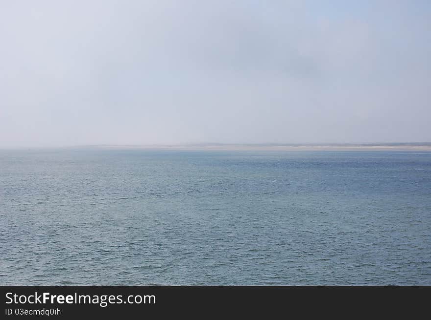 A big coastline with a blue sky. A big coastline with a blue sky