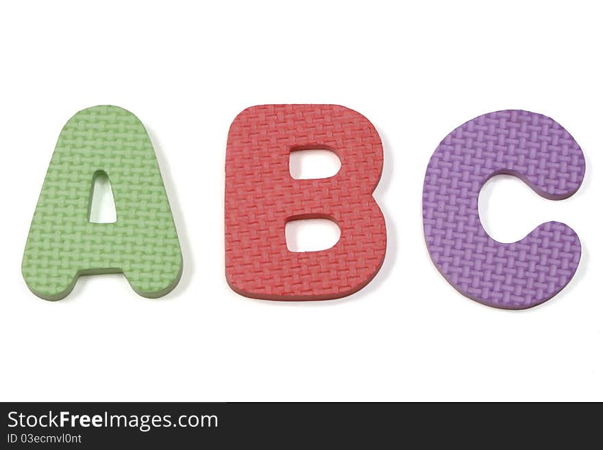 Colorful abc foam letters on a white background. Colorful abc foam letters on a white background