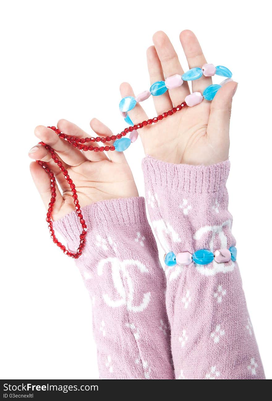 The hands of girls showing glass ornaments isolated on white with clipping path