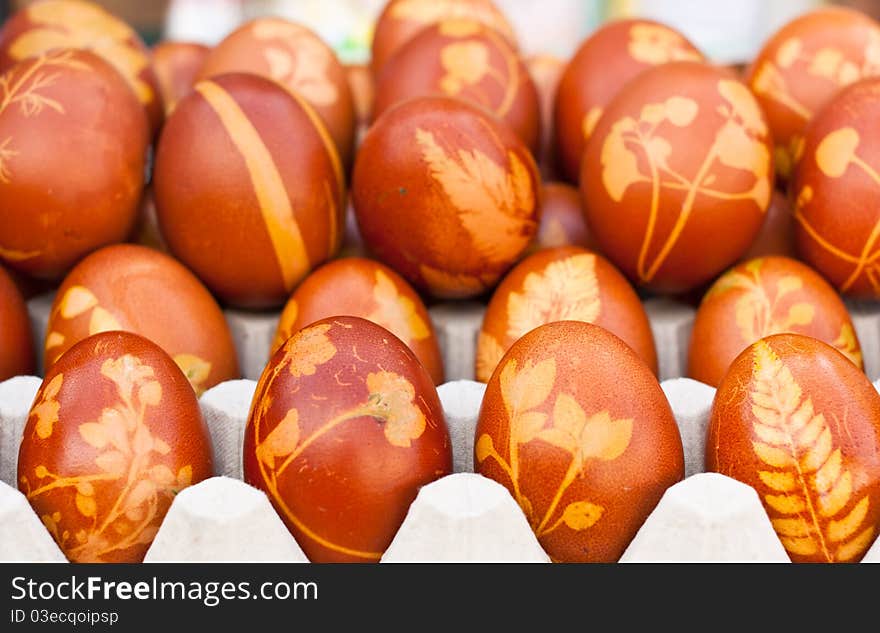 Brown eggs with herbal ornaments on a market. Brown eggs with herbal ornaments on a market