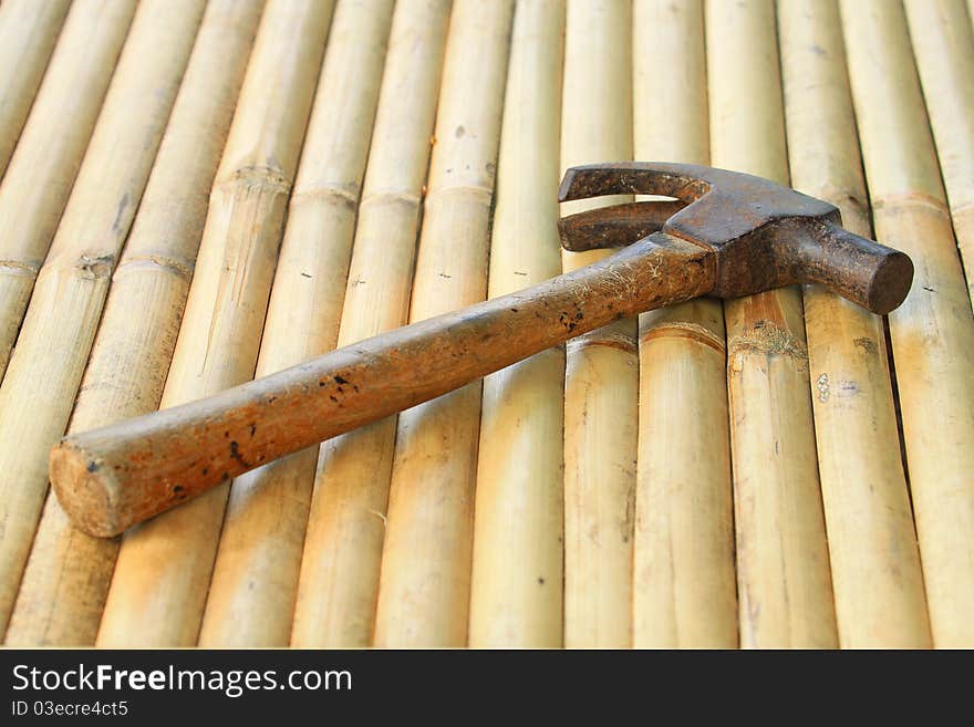 One hammer on background bamboo