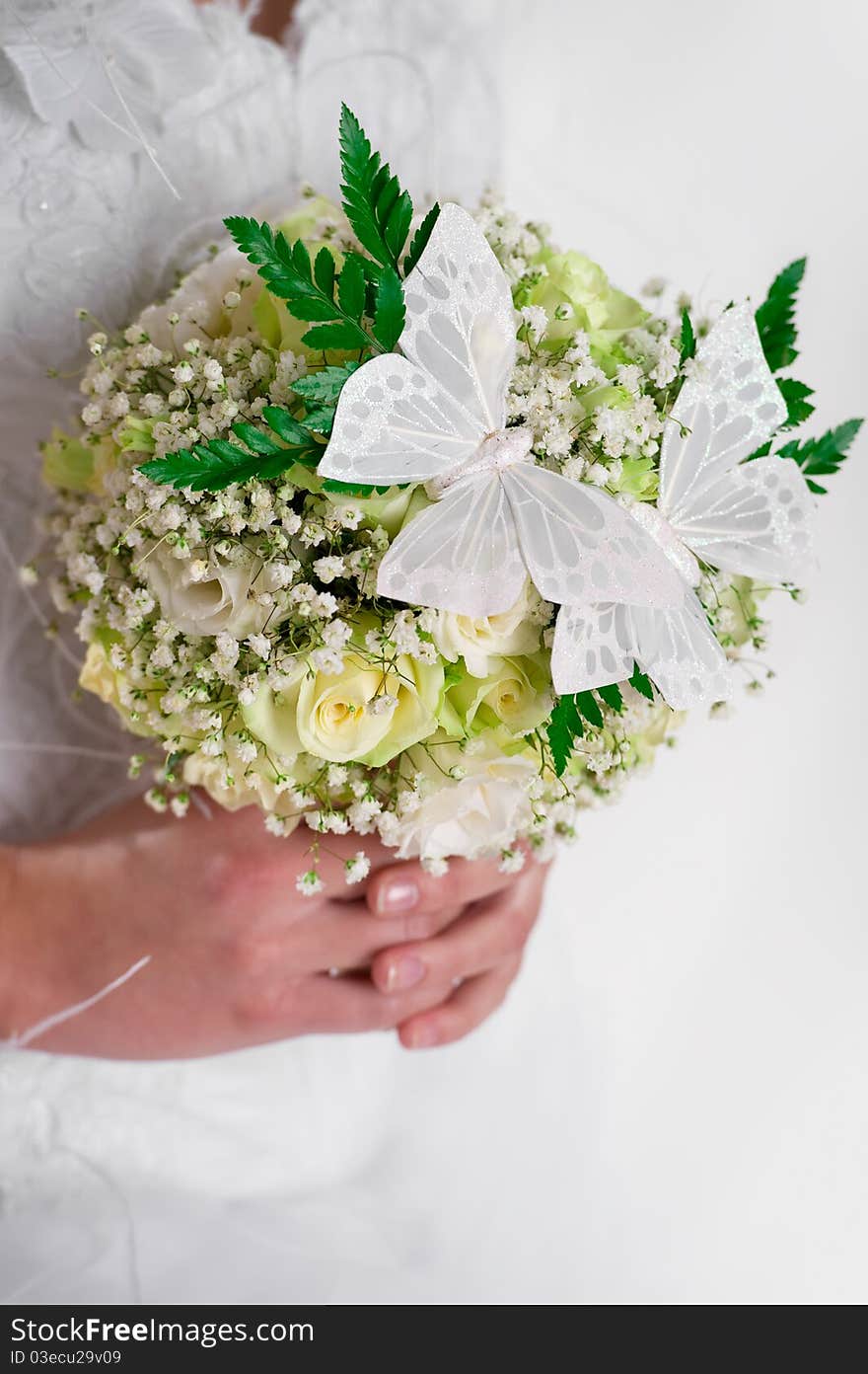 Beautiful bridal bouquet decorated with butterflies