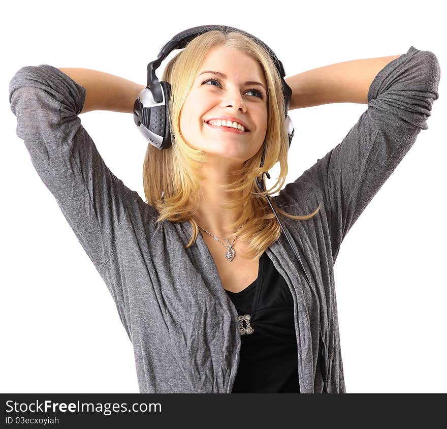 Pretty young girl enjoys listening music