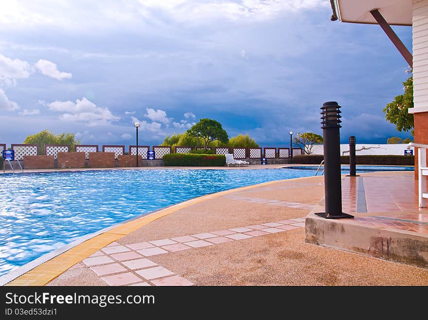 Swimming pool in curve style with blue sky. Swimming pool in curve style with blue sky