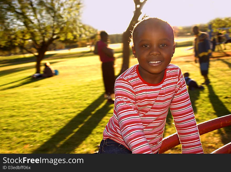 Young girl on a merry-go-round late afternoon