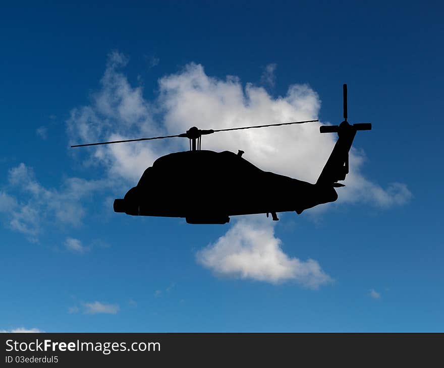 Helicopters silhouetted in a blue sky