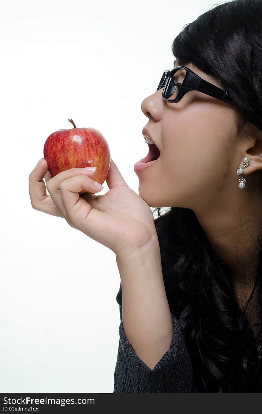 Portrait of cheerful young woman holding a red apple. Portrait of cheerful young woman holding a red apple