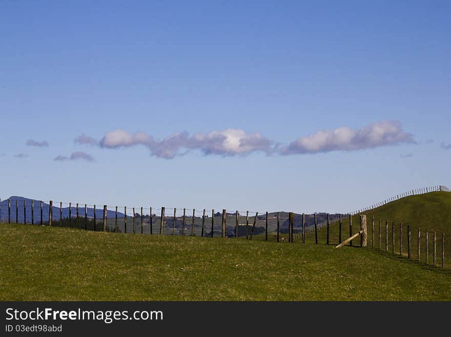 Sheep fence lining farms on a clear day. Sheep fence lining farms on a clear day