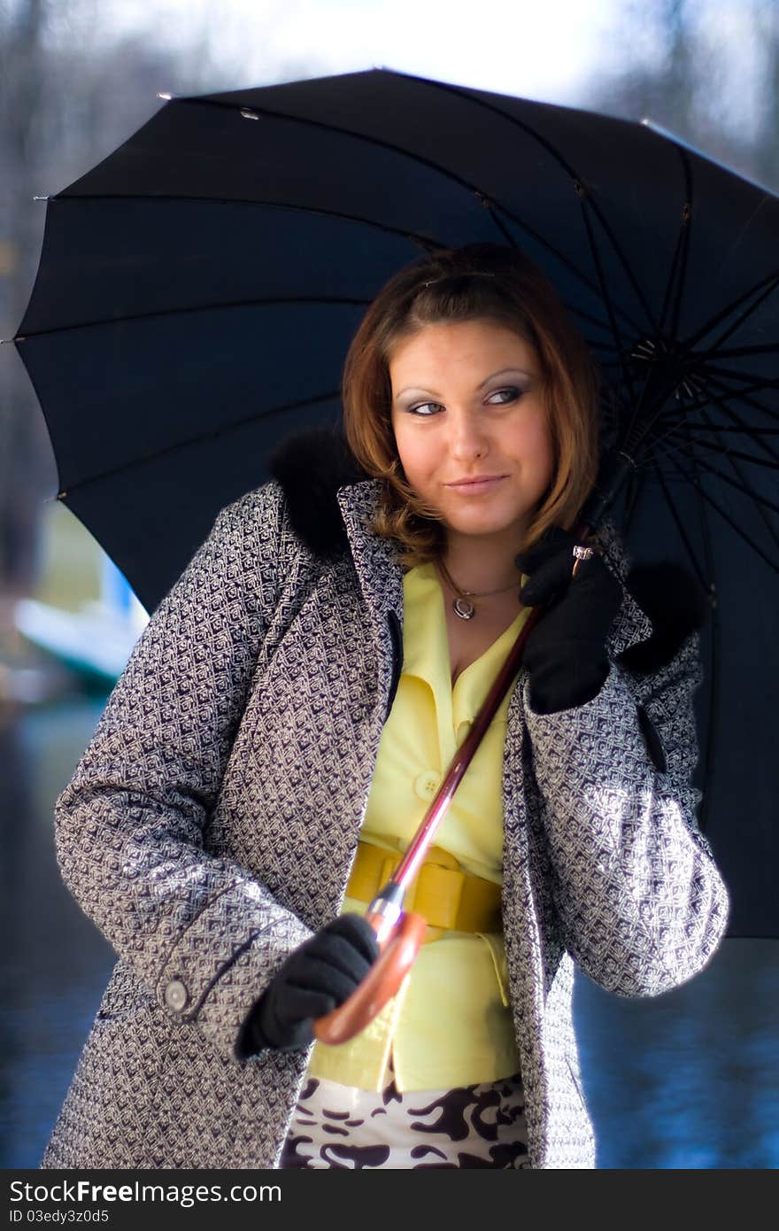 Portrait of beautiful girl with black umbrella. Portrait of beautiful girl with black umbrella