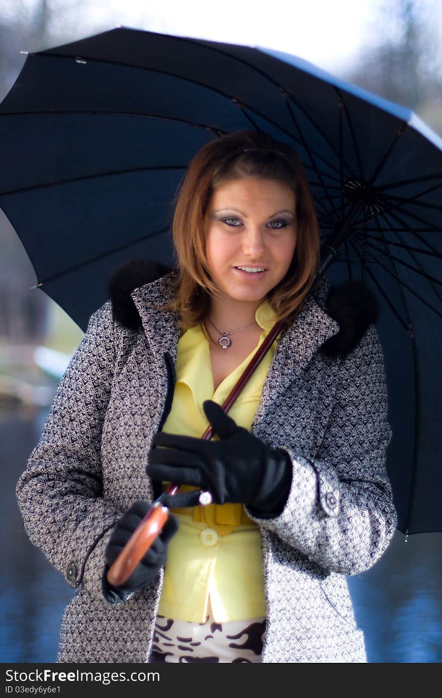 Portrait of beautiful girl with black umbrella. Portrait of beautiful girl with black umbrella