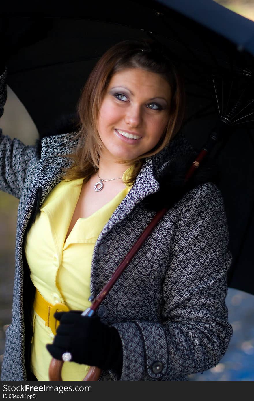 Portrait of beautiful girl with black umbrella. Portrait of beautiful girl with black umbrella