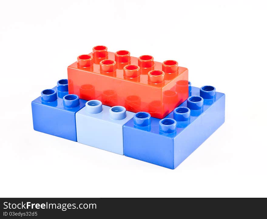 Plastic building blocks on white background. Bright colors.