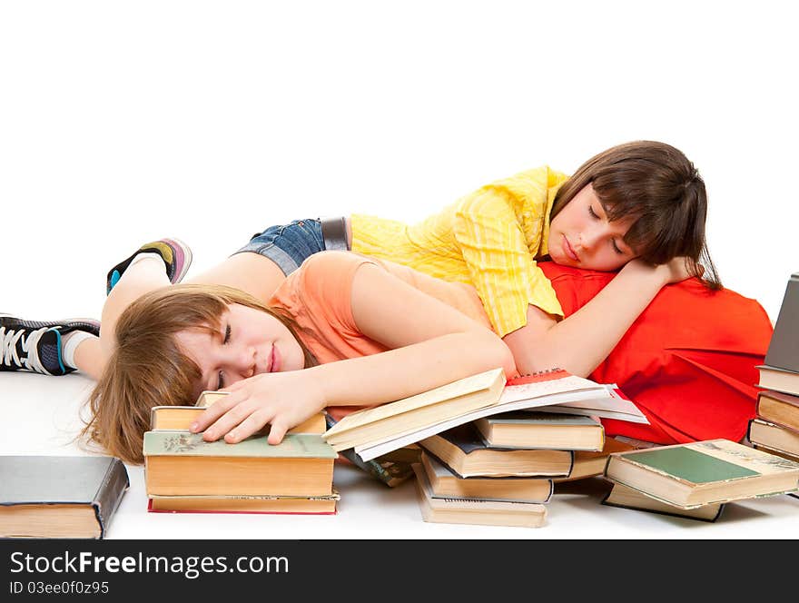 Two schoolgirls were tired of reading books and fell asleep