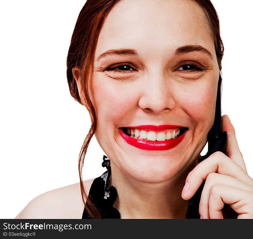 Caucasian woman talking on a mobile phone isolated over white. Caucasian woman talking on a mobile phone isolated over white