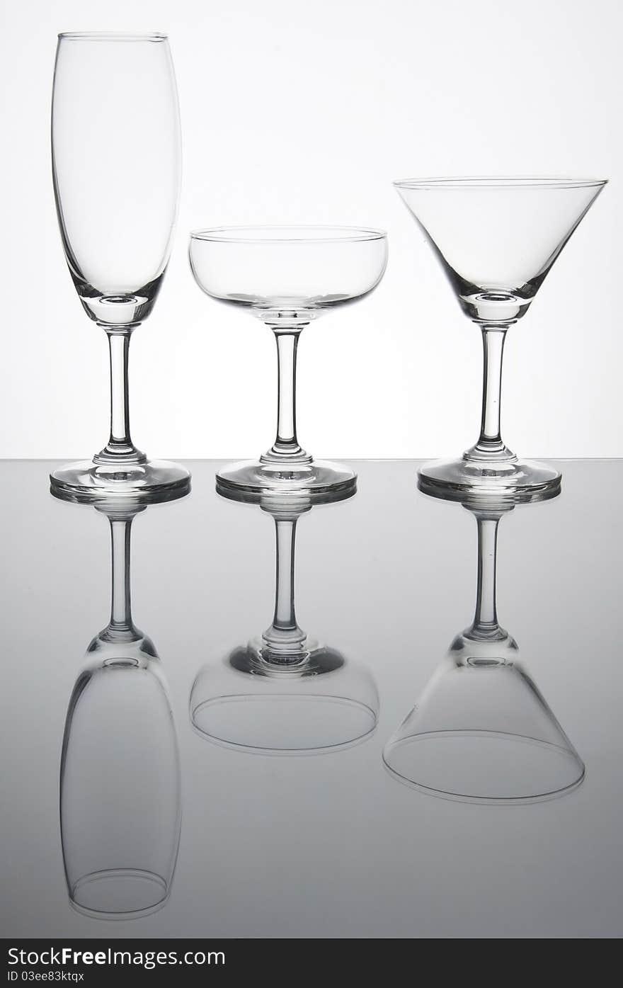 Empty glass with reflection as white isolate background