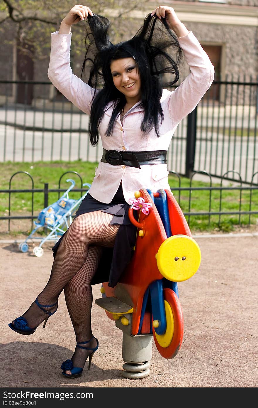 Beautiful cute girl on ladder in playground. Outdoor park. Beautiful cute girl on ladder in playground. Outdoor park.