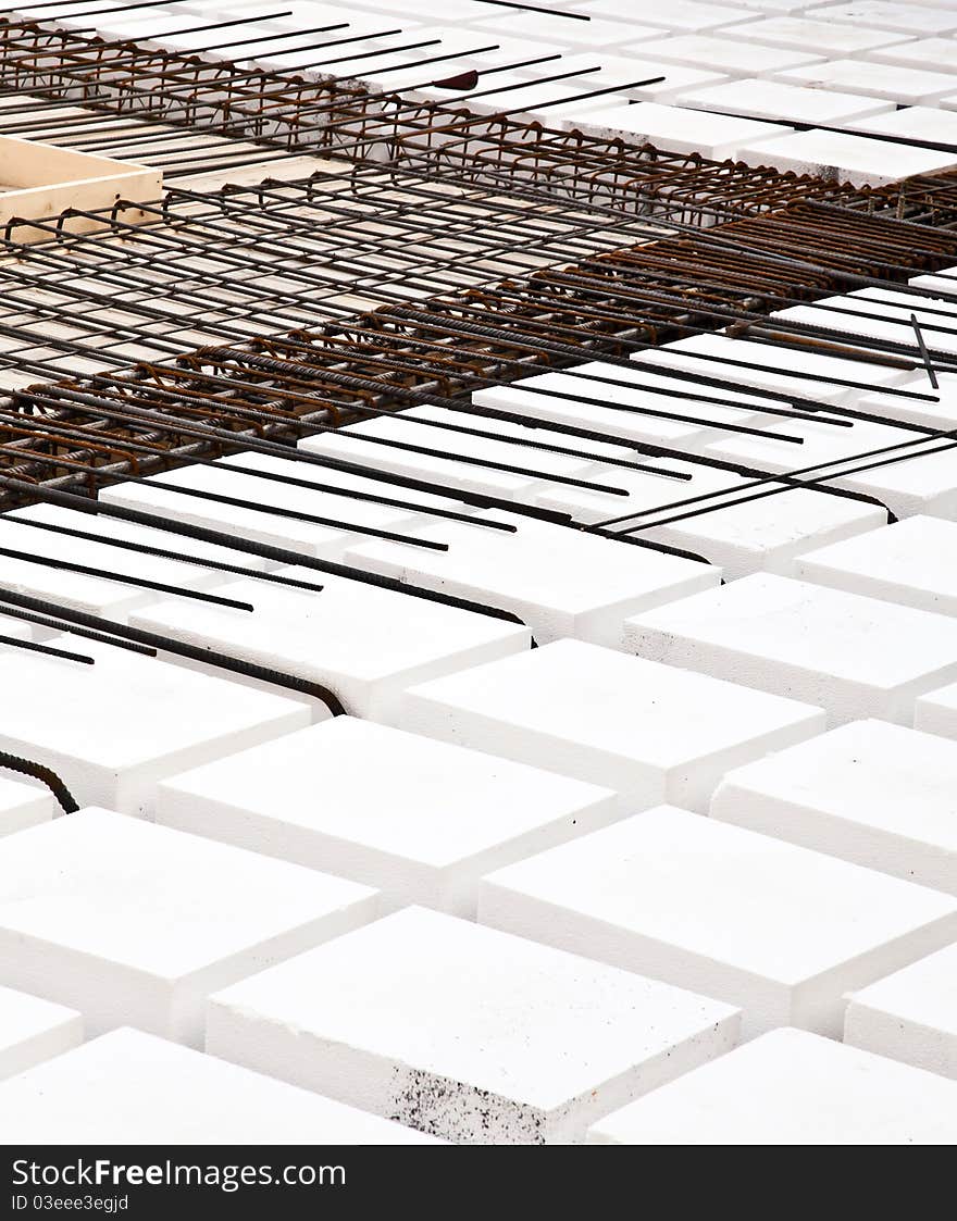 Technical detail of building operations: floor. Materials: polystyrene, steel bars, concrete. Technical detail of building operations: floor. Materials: polystyrene, steel bars, concrete