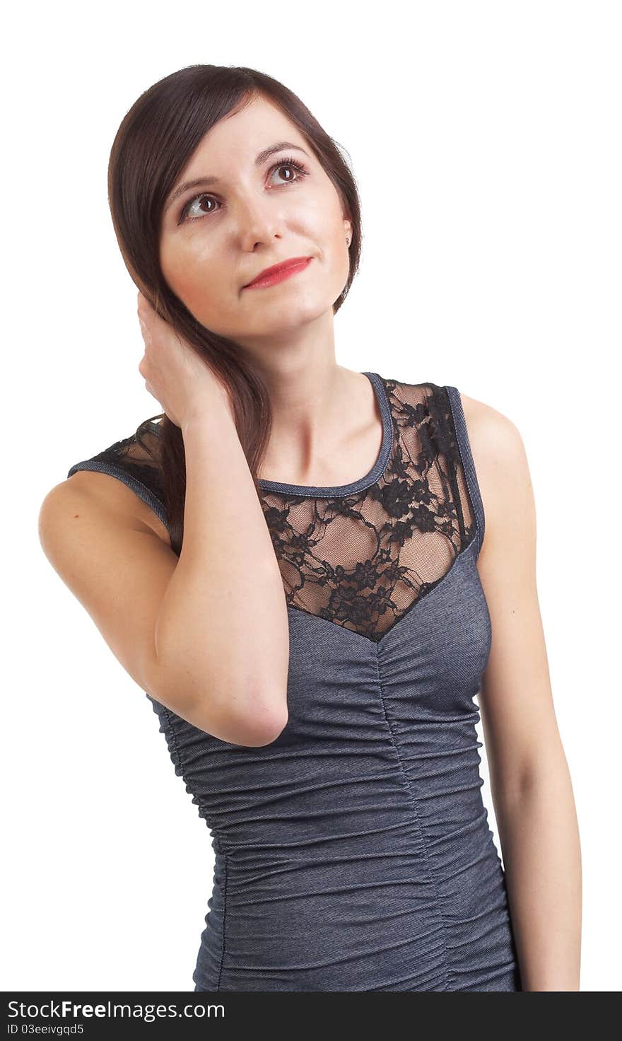 Beautiful girl with long dark hair with a smile looks upwards