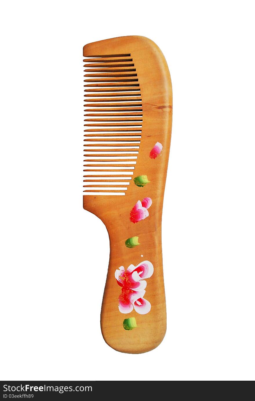 The wooden comb is on the white background