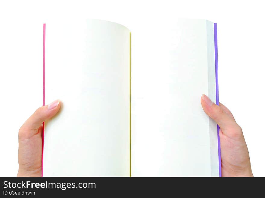 The hand is opening the book that on the white background. The hand is opening the book that on the white background