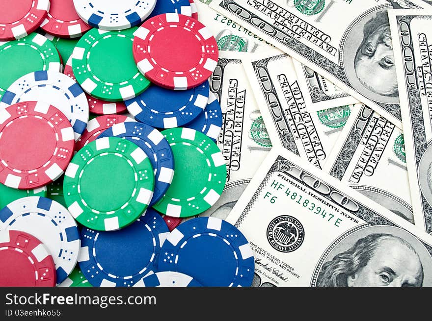 Poker chips and dolars on a background