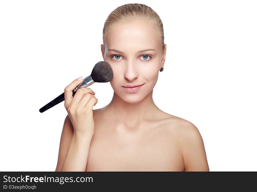 Beautiful Blond Woman Applying Blusher